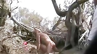 Couple having sex in public at the beach